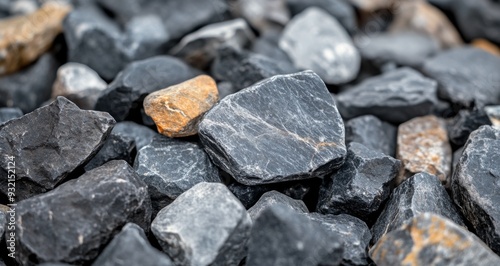 Collection of smooth river stones in various shades on a natural surface