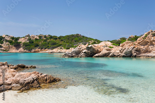 View from shore across the calm turquoise waters of Cala Napoletana, Caprera Island, La Maddalena Archipelago National Park, Sassari, Sardinia, Italy, Mediterranean photo