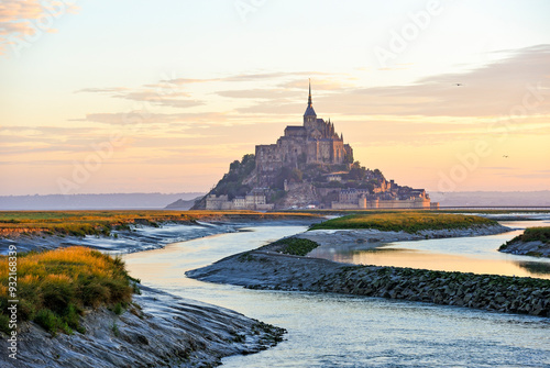 Mont-Saint-Michel, UNESCO World Heritage Site, in the mouth of the Couesnon river at sunrise, Manche department, Normandy region, France