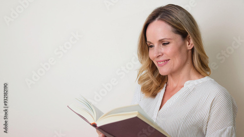 Middle-Aged Blonde Woman Reading a Book