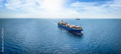 Fototapeta Naklejka Na Ścianę i Meble -  A banner with a high aerial view of a industrial container cargo ship traveling with speed over the ocean with copy space