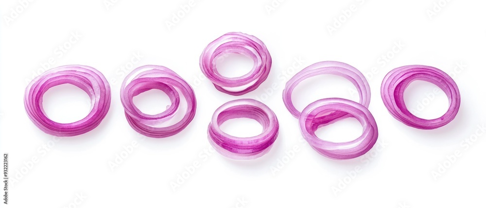 Red Onion Slices Arranged in a Row on White Background Red Onion Slices Arranged in a Row on White Background