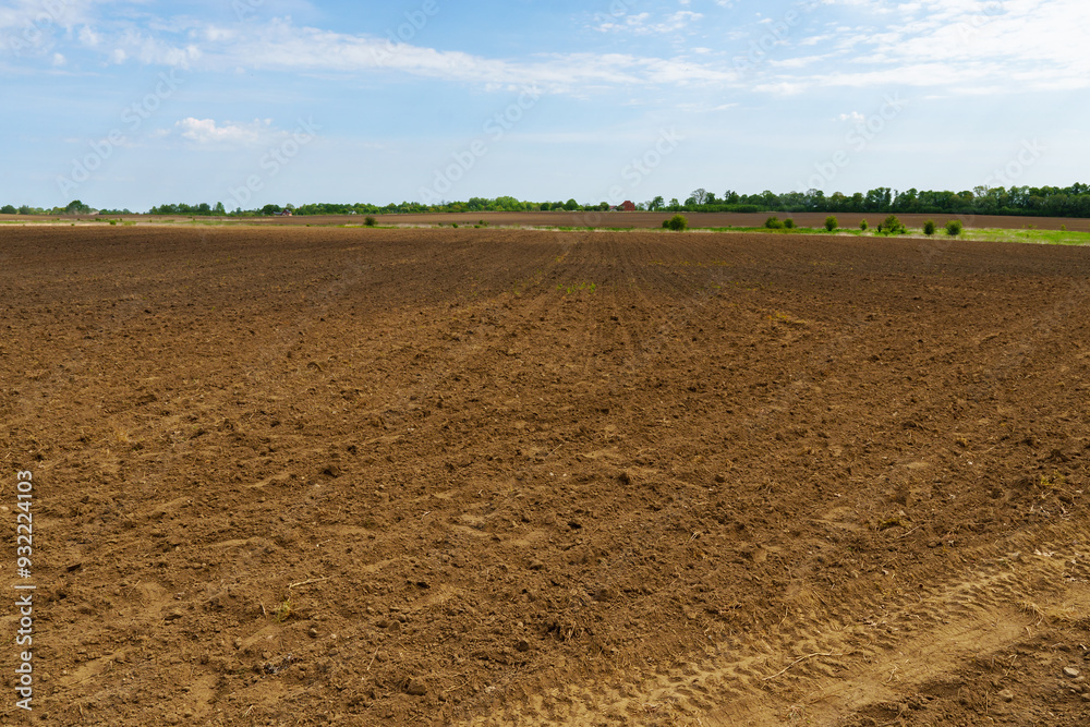 A plowed field. Agricultural land. A field ready for sowing.