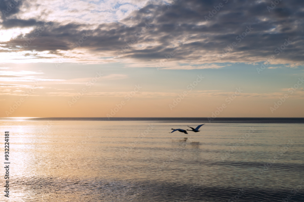 Sunset over the sea. Reflection of sunlight in the sea waves. The sky in the sunset rays. Baltic Sea. Sunset over the sea. Reflection of sunlight in the sea waves. The sky in the sunset rays. Baltic Sea.