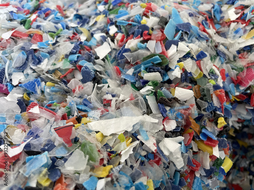 Closeup image of colorful plastic flakes. Concept pollution, environment, save the planet. PP plastic recycling from bottles. Bottle cap. PET bottle recycled. High quality photo