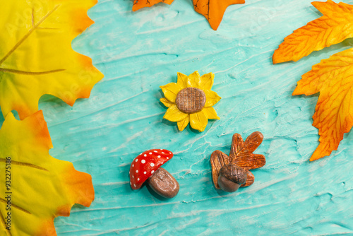 Handmade Air Dry Clay Fridge Magnets. Autumn Figurines. Mushroom, Sunflower, Oak leaf and Acorn. Autumn leaves detail frame. photo