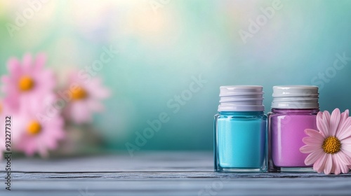 Colorful nail polish bottles lined up on a wooden table with blurred floral b...