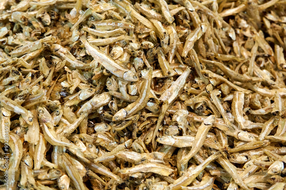 A large assortment of dried fish is on display in the Asian store. A large assortment of dried fish is on display in the Asian store.