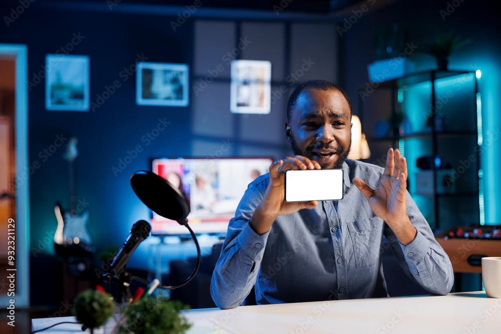 African american man filming himself watching internet videos on mockup smartphone requested by followers. Media star reacting to online clips sent by subscribers using isolated screen mobile phone African american man filming himself watching internet videos on mockup smartphone requested by followers. Media star reacting to online clips sent by subscribers using isolated screen mobile phone