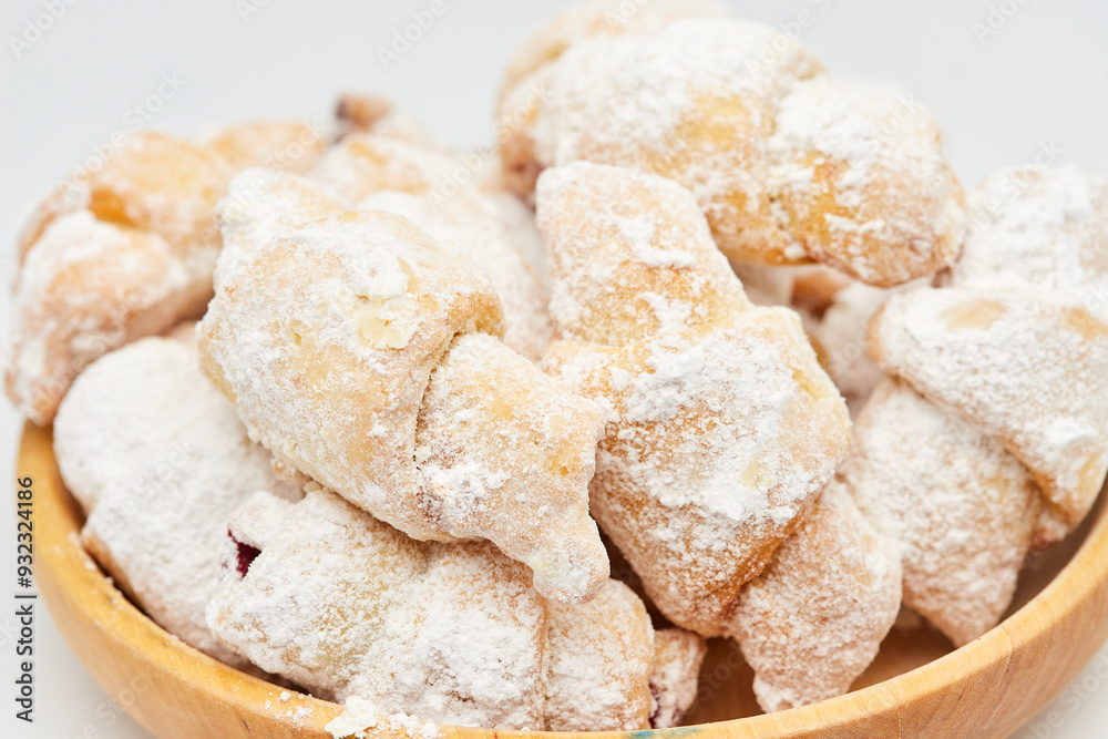 Powdered sugar-coated pastries filled with jam, perfect for sweet cravings and dessert lovers Powdered sugar-coated pastries filled with jam, perfect for sweet cravings and dessert lovers