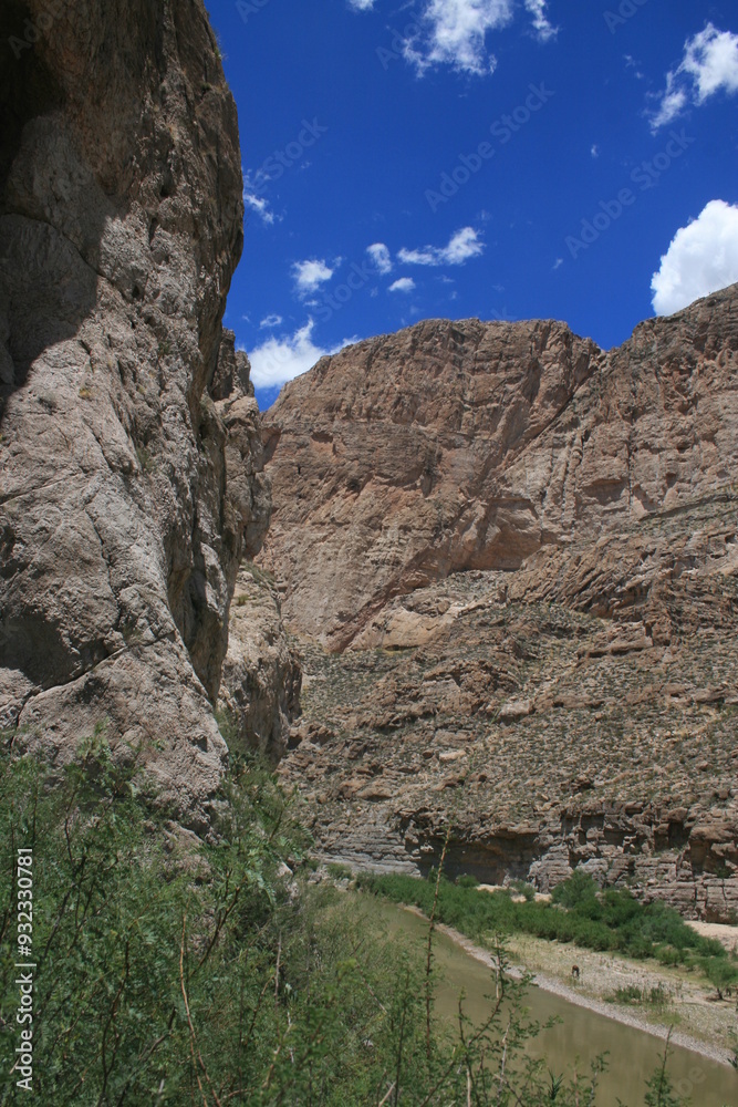 The Grand Canyon mountains under a clear sky, emphasizing the vastness and tranquility of the natural environment. The Grand Canyon mountains under a clear sky, emphasizing the vastness and tranquility of the natural environment.