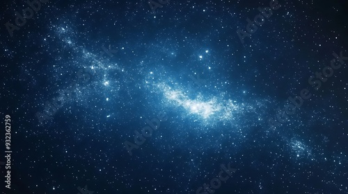 A starry night sky with a bright galaxy in the center, set against a deep blue background.