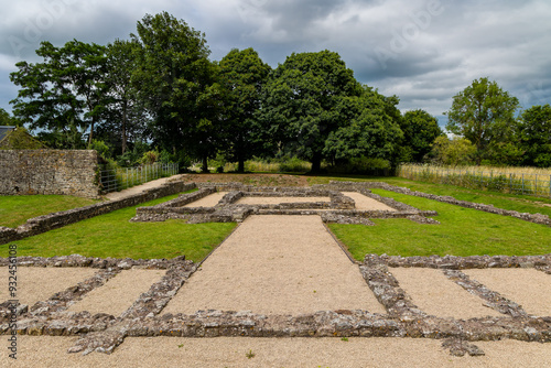 Walls and foundations of an ancient Roman temple to an unknown deity in Caerwent, Wales photo
