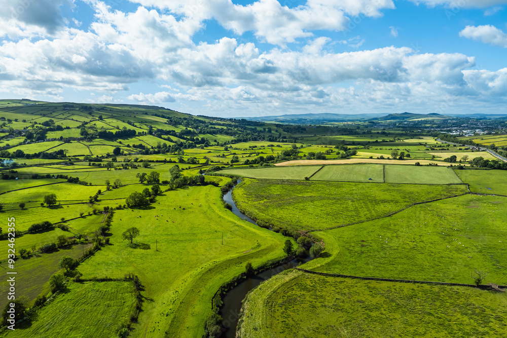 Farms and Fields over Cononley and River Aire from a drone, Keighley, North Yorkshire, England Farms and Fields over Cononley and River Aire from a drone, Keighley, North Yorkshire, England