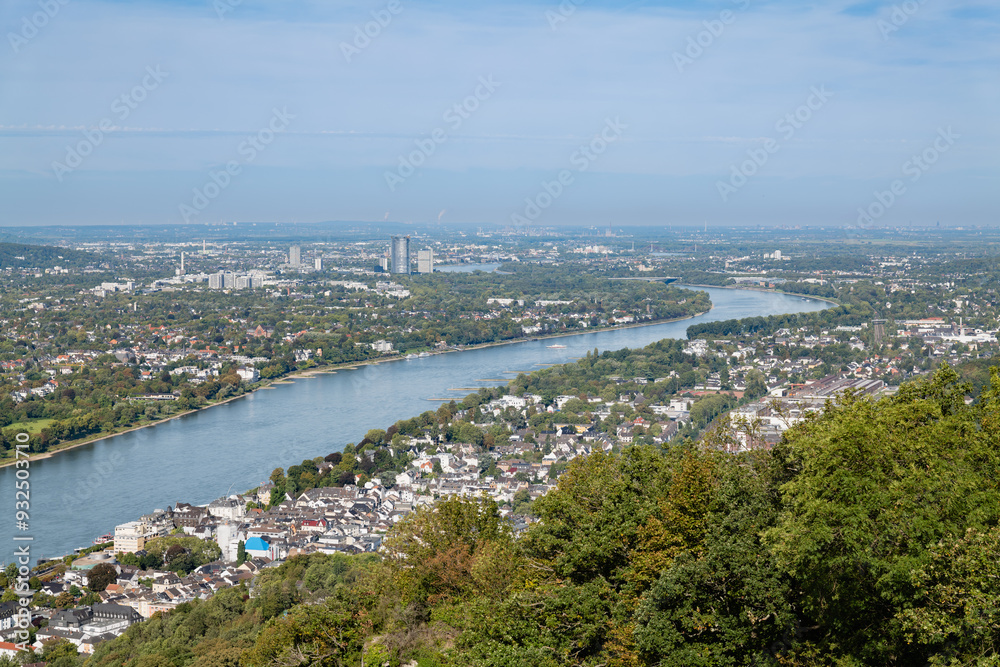 Panoramic view of the Rhine River and surrounding cityscape from Drachenfels, showcasing the region's urban and natural landscapes. Panoramic view of the Rhine River and surrounding cityscape from Drachenfels, showcasing the region's urban and natural landscapes.
