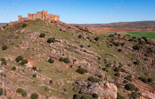 Ruins of Castle of Riba de Santiuste from afar. Drone photo of medieval stronghold in Siguenza, Spain. photo