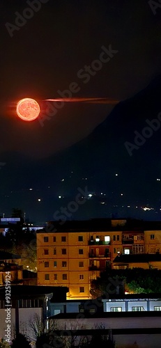 Panorama città con sfondo luna rossa .  photo