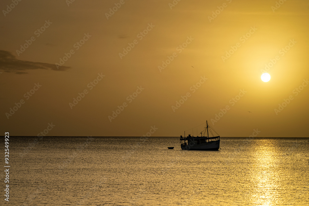 Fishing boat in Juan Griego Bay at sunset. Margarita Island, Nueva Esparta State. Venezuela.