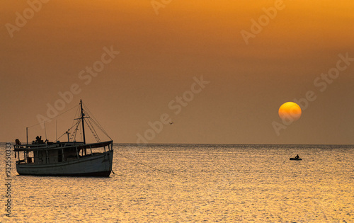 Fishing boat in Juan Griego Bay at sunset. Margarita Island, Nueva Esparta State. Venezuela.