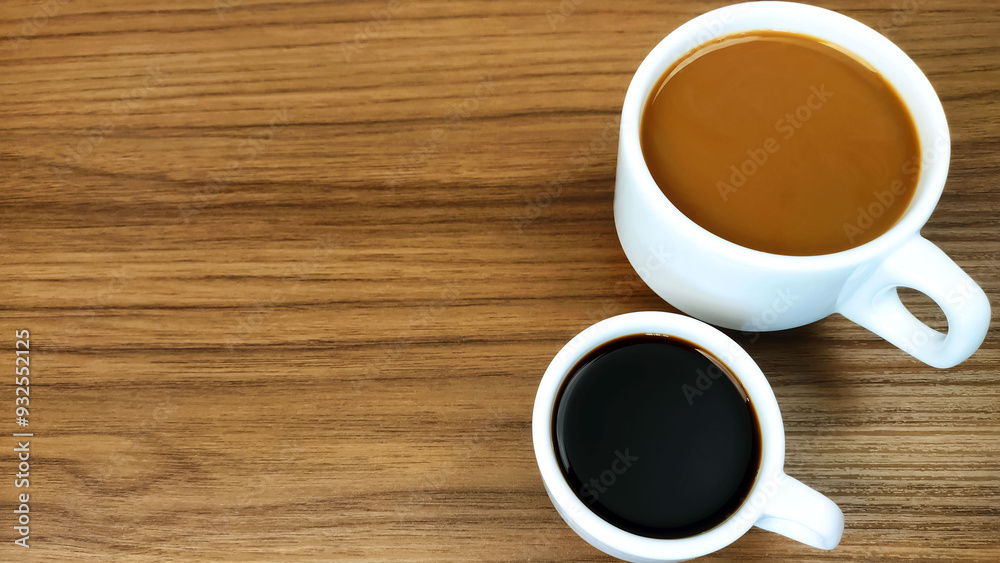 Cup of coffe, cup of milk with coffee or latte known as pingado in Brazil on the wooden table
Cup of coffe, cup of milk with coffee or latte known as pingado in Brazil on the wooden table