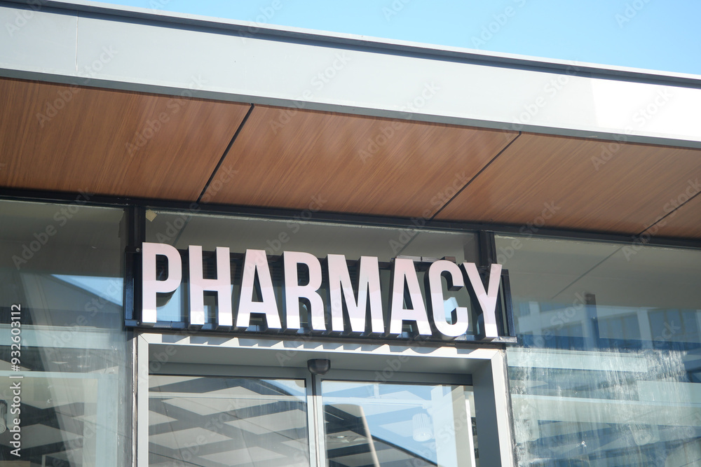 A colorful building background with a visible pharmacy sign in the urban street view A colorful building background with a visible pharmacy sign in the urban street view