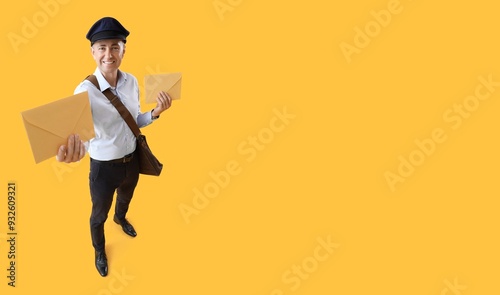 Mature postman with envelop...