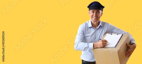 Mature postman with clipboa...