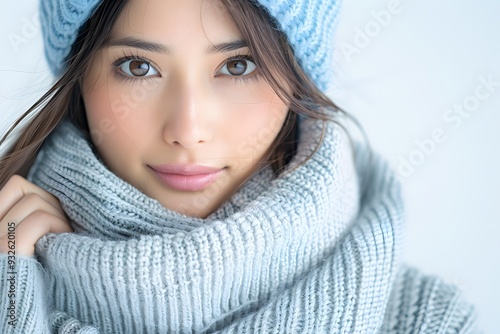 Young Asian woman in winter clothing, seasonal portrait, cool tones, isolated on white background