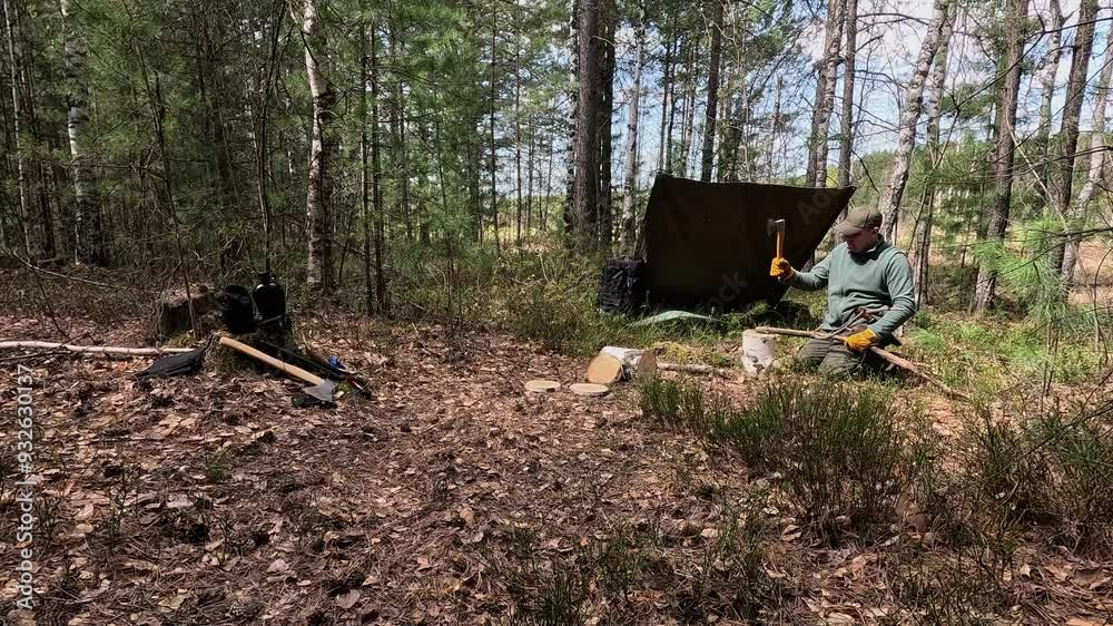 A tourist hid under a canopy in the forest A tourist hid under a canopy in the forest
