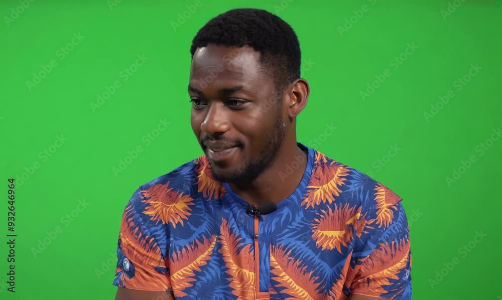 Ivorian Man Enjoying Television with Chroma Green Screen
