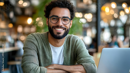 A smiling man at a café wit...