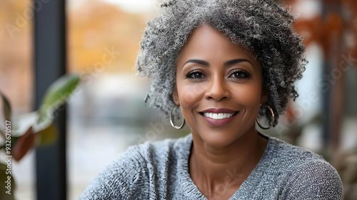 A smiling woman with gray h...