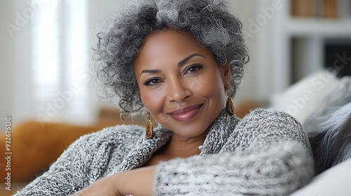 A woman with curly gray hai...