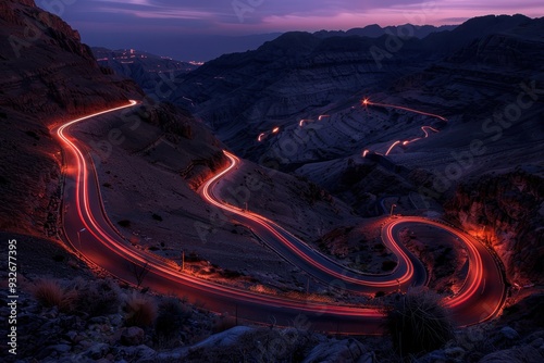 Mountain valley landscape with stunning light trails on zigzag road photo