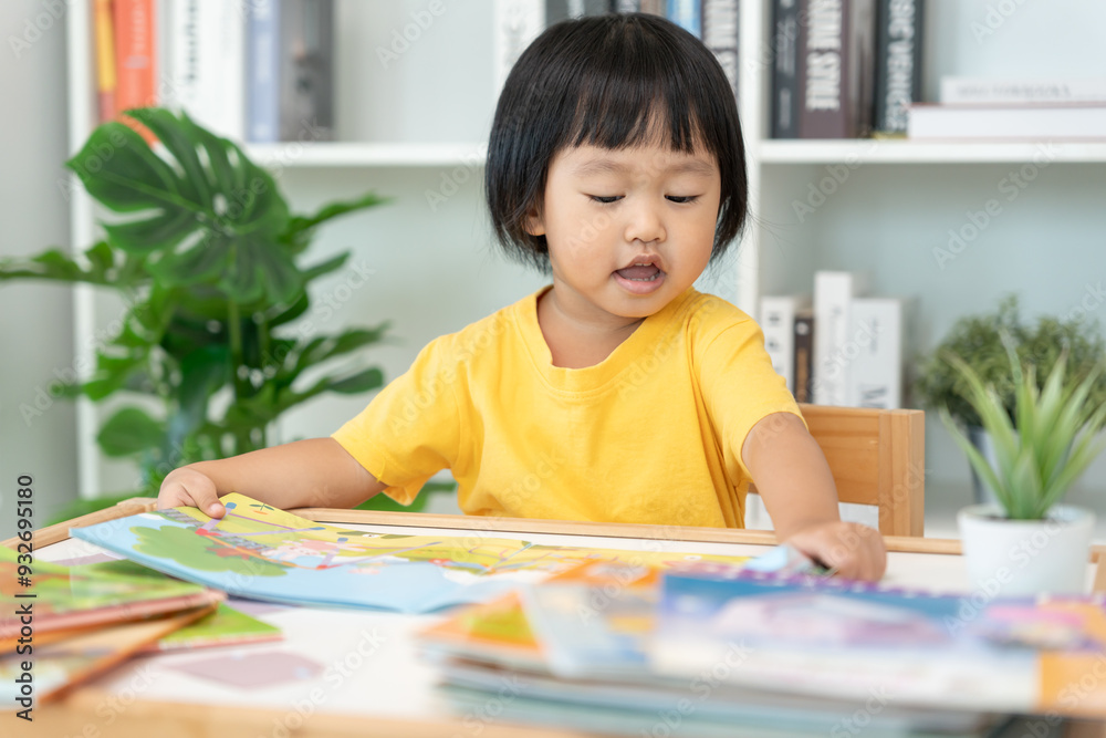 Happy Asian children relax read book at home. daughter and reading a story. learn development, childcare, laughing, education, storytelling, practice, imagine, reduce addiction mobile phone Happy Asian children relax read book at home. daughter and reading a story. learn development, childcare, laughing, education, storytelling, practice, imagine, reduce addiction mobile phone