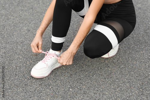 Young woman in sportswear a...