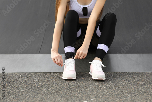 Young woman in sportswear a...