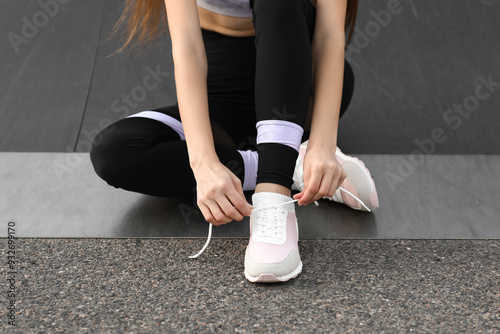 Young woman in sportswear a...