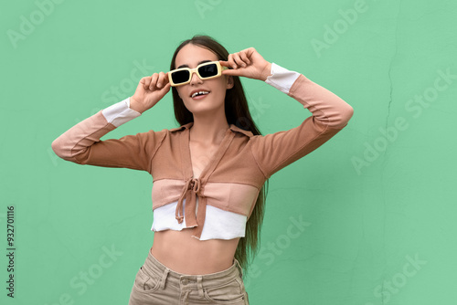 Beautiful young woman in st...