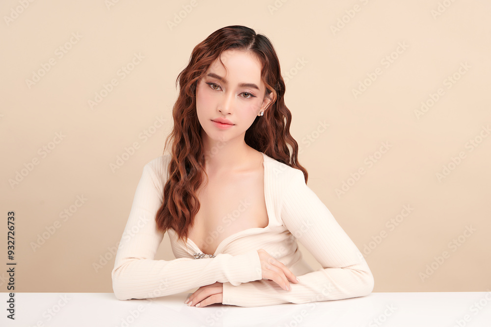 Naklejka premium Beautiful young asian woman with clean fresh skin on beige background, Face care, Facial treatment, Cosmetology, beauty and spa, Asian women portrait.