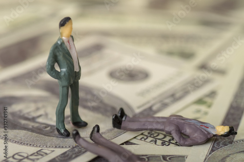 Quadro em tela The businessman stood resolutely, casting a glance at the rival who lay defeated among stacks of money, signifying his triumph and the end of their fierce competition