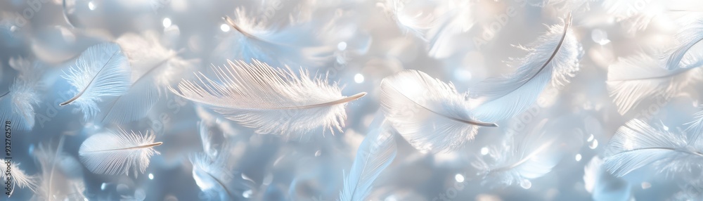 Naklejka premium Ethereal White Feathers Floating in Soft Light with Sparkling Bokeh Background