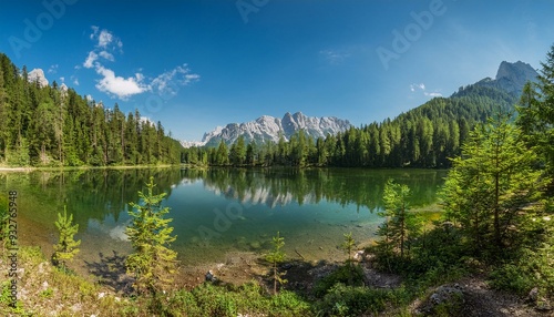 Lake Between Forests And Mountains