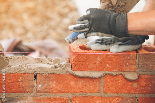 Wallpaper Mural  Worker Laying Bricks in a Construction Project During Daylight Hours Torontodigital.ca