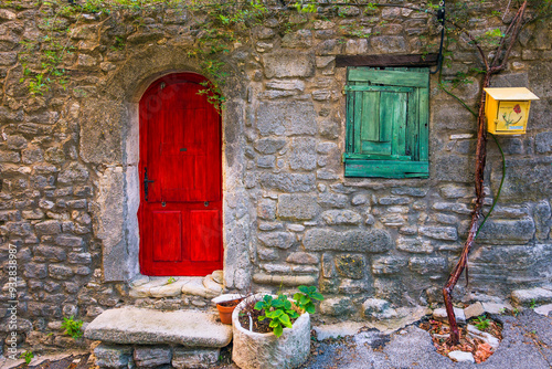 Europe, France, Saignon. Rustic stone house exterior.
