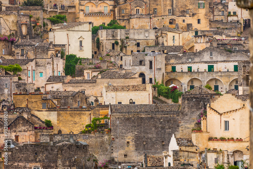 Italy, Basilicata, Province of Matera, Matera. Old stone buildings on a steep hillside. photo