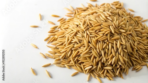 Close-up of a Pile of Unhulled Rice Grains on a White Background photo