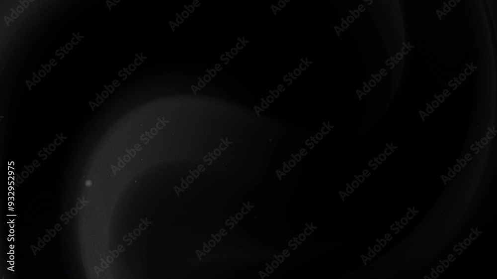 Dark gray and black background with curved shape and speckles. Perfect for backgrounds, print design, packaging, and minimalistic concepts. Dark gray and black background with curved shape and speckles. Perfect for backgrounds, print design, packaging, and minimalistic concepts.