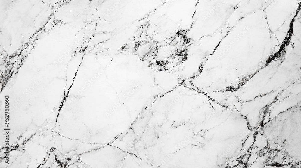 Elegant white marble surface with gray veining highlighted under soft light Elegant white marble surface with gray veining highlighted under soft light