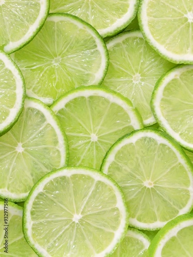 Green background with citrus-fruit of lime slices